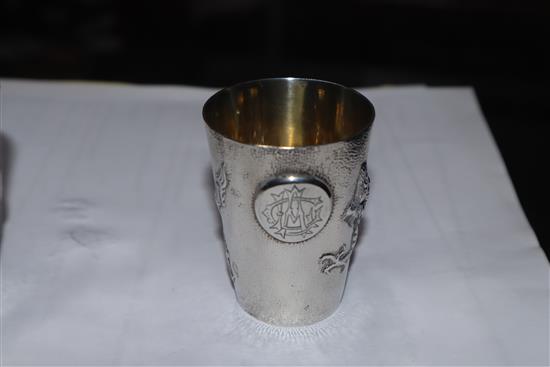 A set of nine early 20th century Chinese Export white metal tots, by Zee Wo, each decorated with a dragon, 13 oz.
